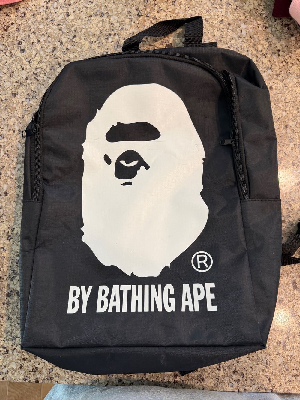 BY BATHING APE Black Logo Backpack with Signature Ape Graphic
